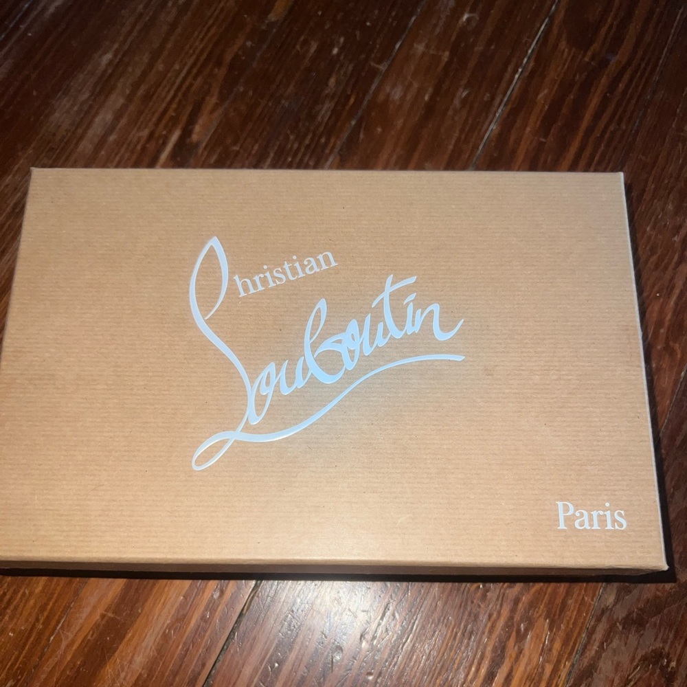 Christian Louboutin nude patent leather Pigalle Follies heels.